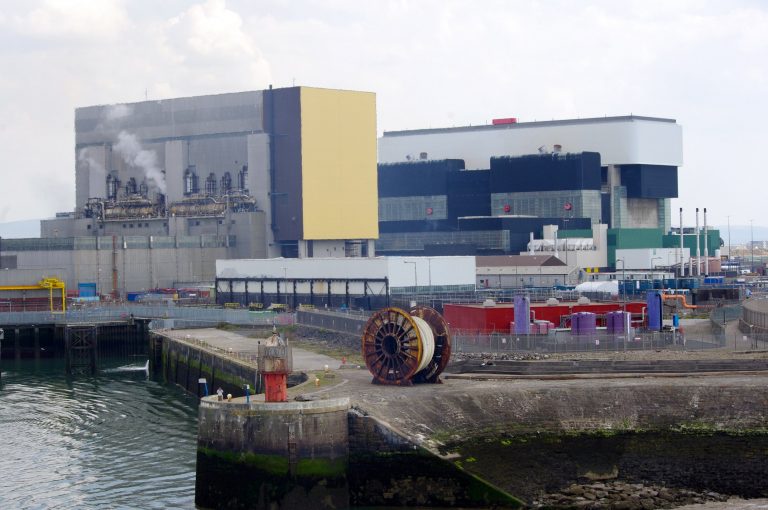 An image of two large nuclear power stations, each cuboid shaped. Heysham 1 is in the foreground, with Heysham 2 behind.