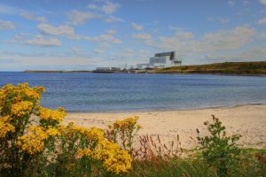 Torness nuclear power station as viewed from a nearby beach. The power plant consists of two advanced gas cooled reactor units (AGRs).
