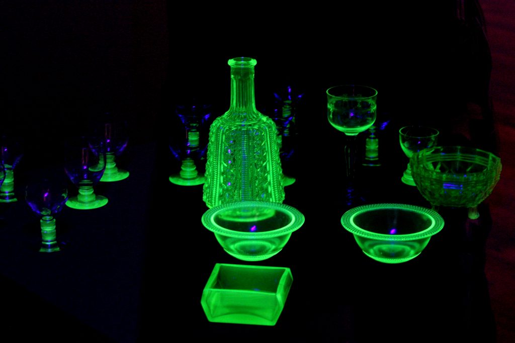 Selection of uranium glassware, including bowls, glasses, and a decanter.