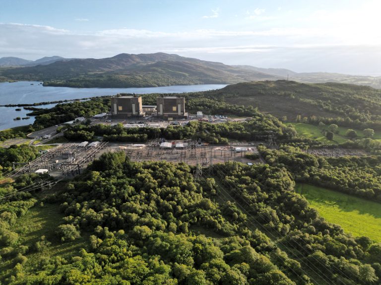 Aerial of Trawsfynydd nuclear power station and the nearby grid connection. The station is surrounded by the national park