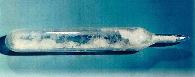 A sealed gas ampoule, containing uranium hexafluoride crystals. This is the product of the conversion stage of the nuclear fuel cycle for uranium.