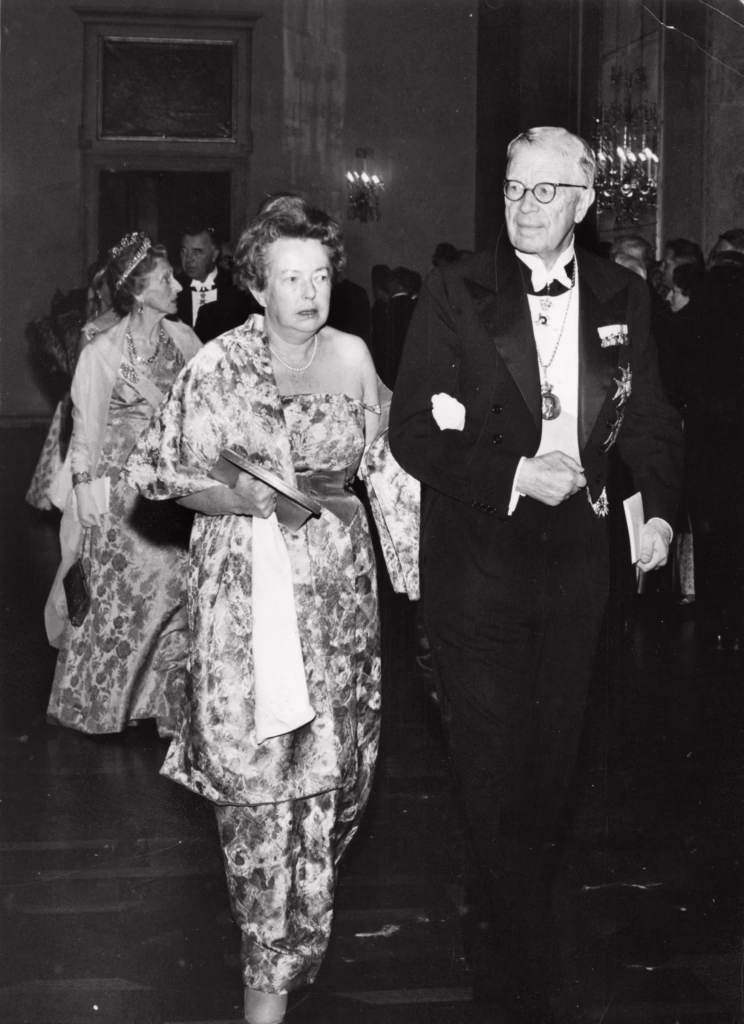 Maria Goeppert-Mayer being accompanied by King Gustaf Adolf of Sweden after receiving her Nobel Prize in physics