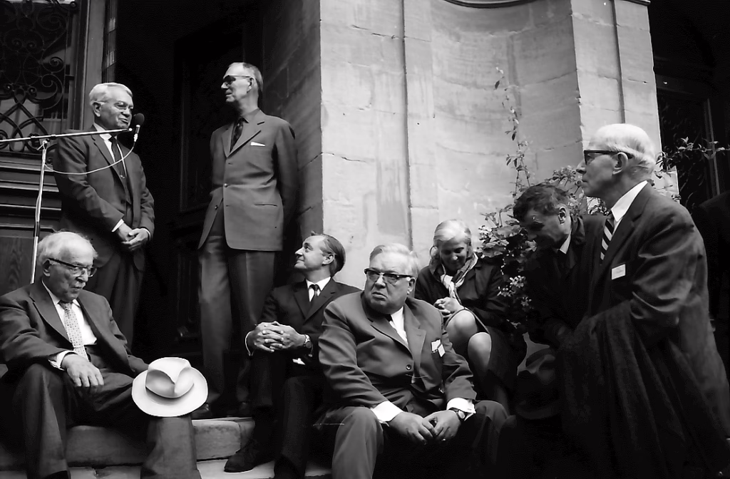 Harold Urey (standing by the microphone) at a chemistry conference, 1970