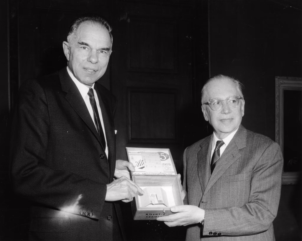 Emilio Segrè and Glenn Seaborg presenting a cigar box containing the first sample of plutonium-239